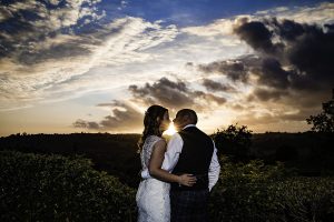 Bride and Groom watching the sunset