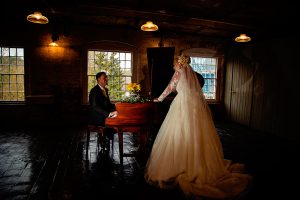 Groom playing the piano to Bride at The West Mill Derby
