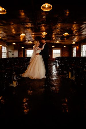 Bride and Groom facing each other at The West Mill Derby