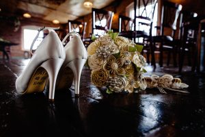 Wedding shoes and paper flowers at The West Mill derby