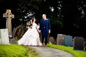 Bride and Groom walking from the church at Tissington Derbyshire