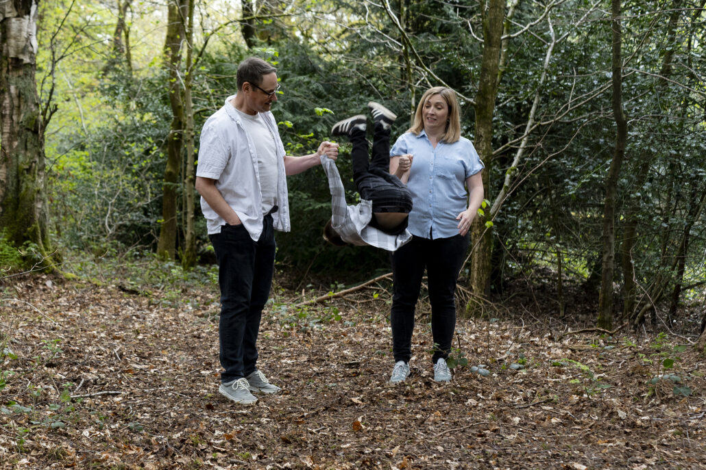 Parents throwing child in the air